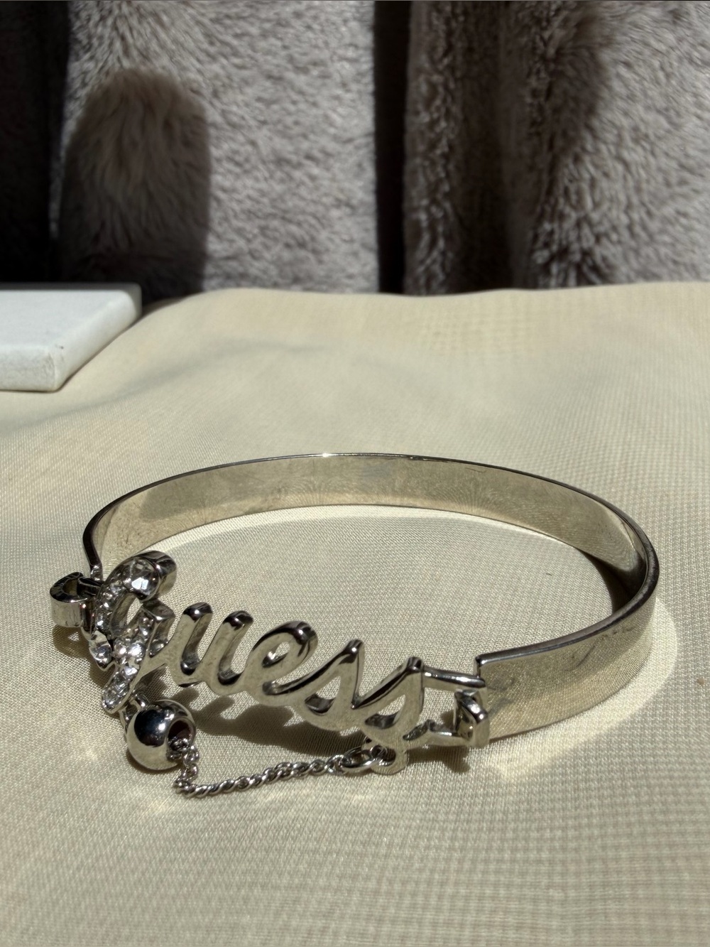GUESS Silver Tone Rhinestone Script Logo Bangle Hinge Bracelet with Charm Detail